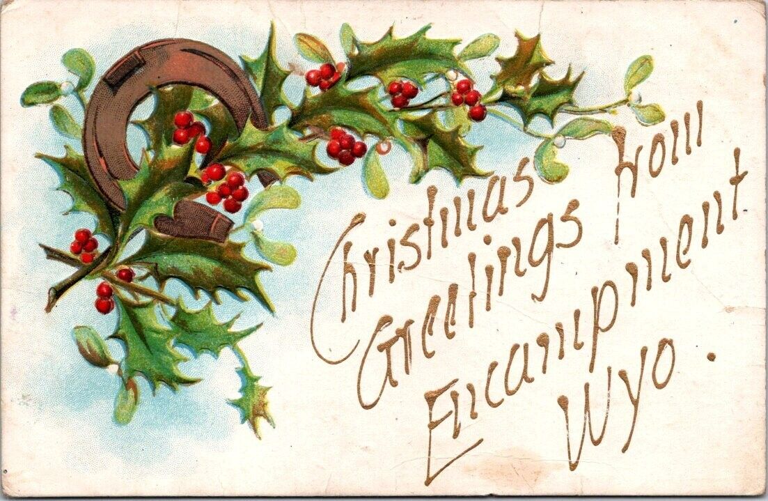 Encampment WY Christmas Holly Horseshoe Gold Embossed c1910s postcard BQ6