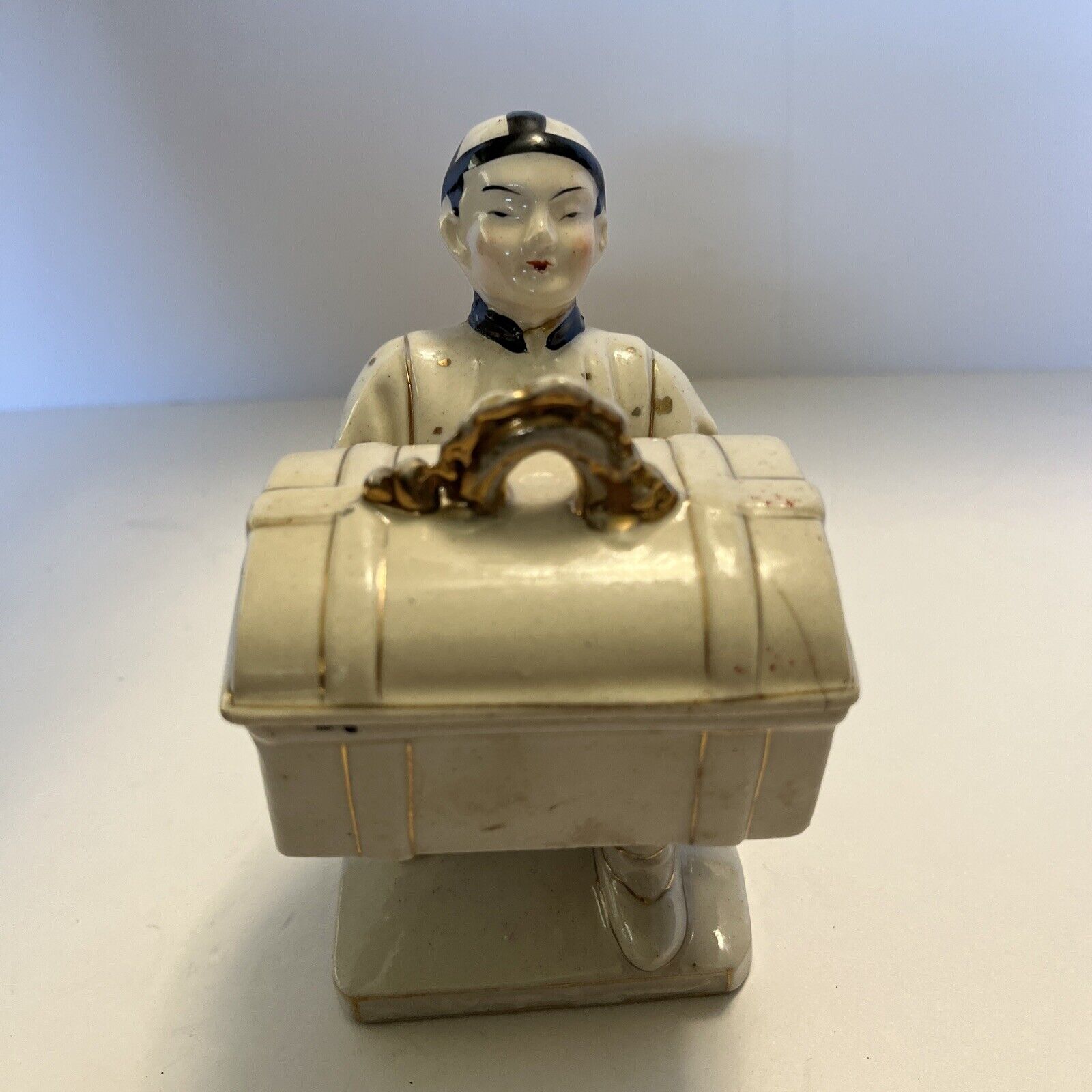 Vintage Japan Earthenware figure man with chest Asian art costume. Occupied?