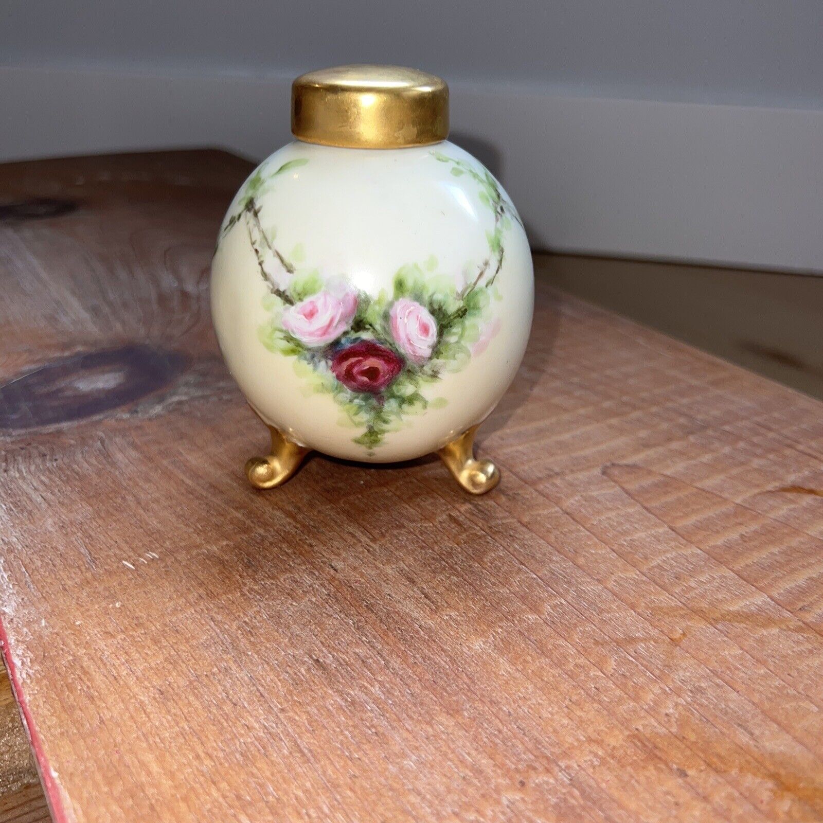 french limoges...UNUSUAL GOLD LIDDED VASE WITH 3 FEET IN GOLD.  marked AUSTRIA