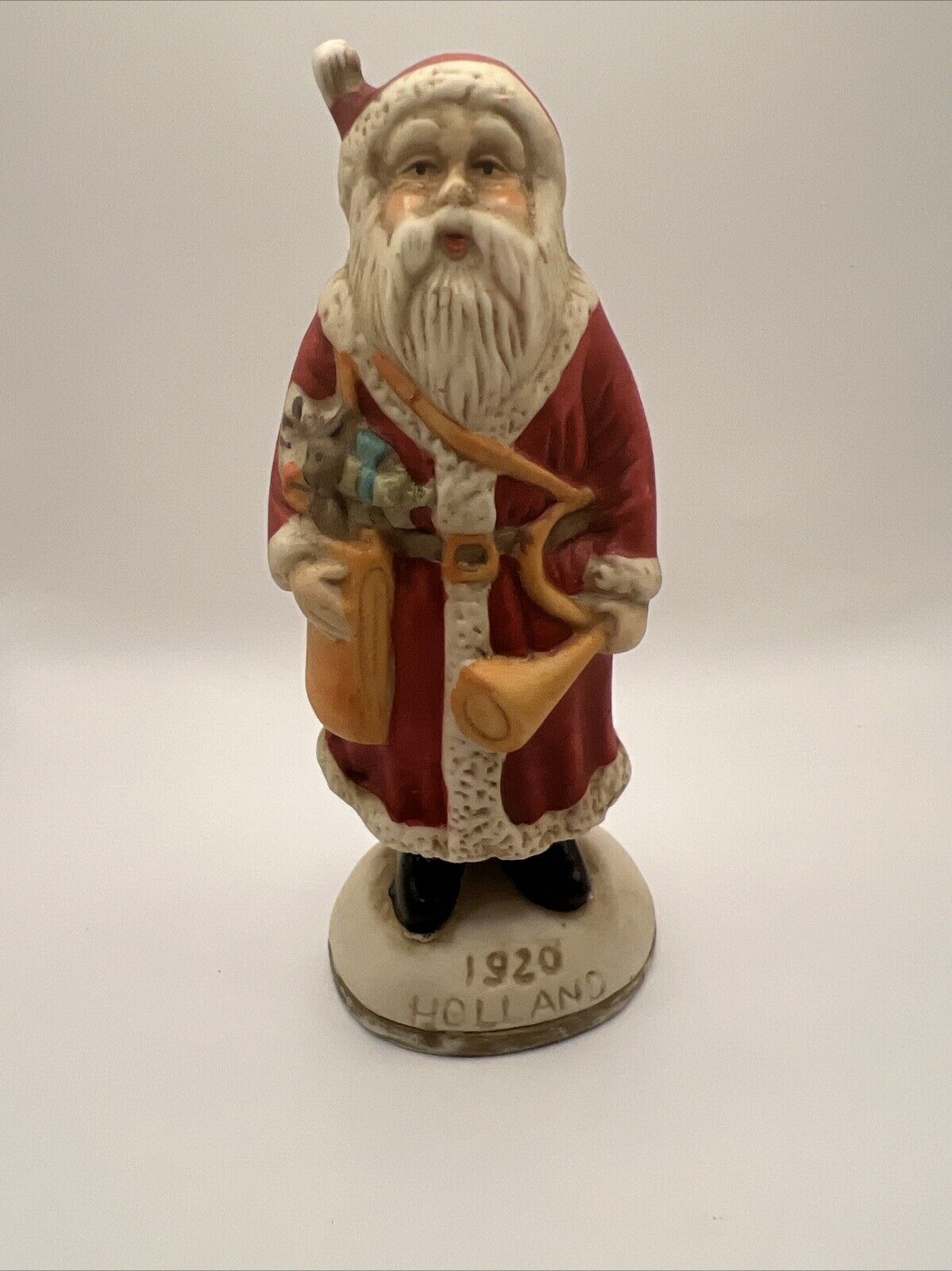 Vintage Santa From Around the World Holland 1920 Santa holding a Horn Figurine