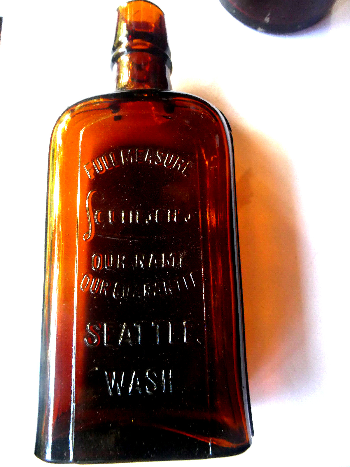 Rare Amber  Western flask LEVINSONS OUR NAME OUR GUARANTEE SEATTLE WASH.