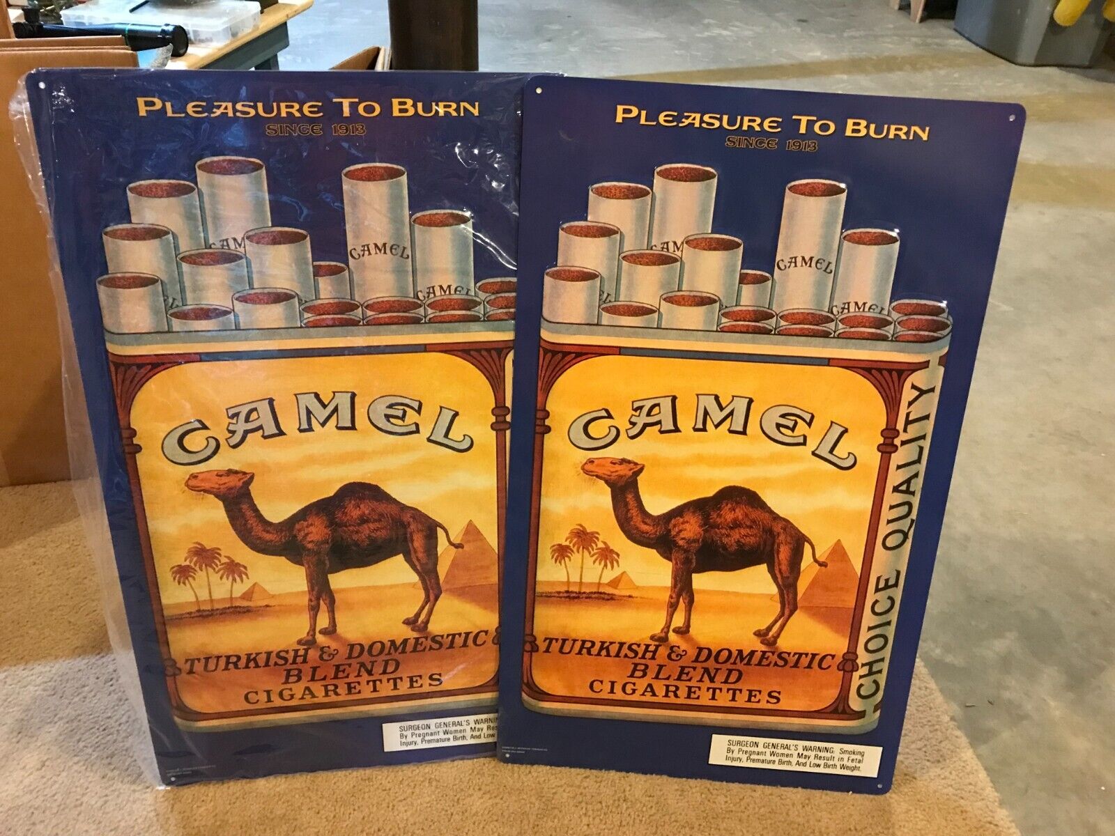 Two Large Vintage Camel Cigarette Signs