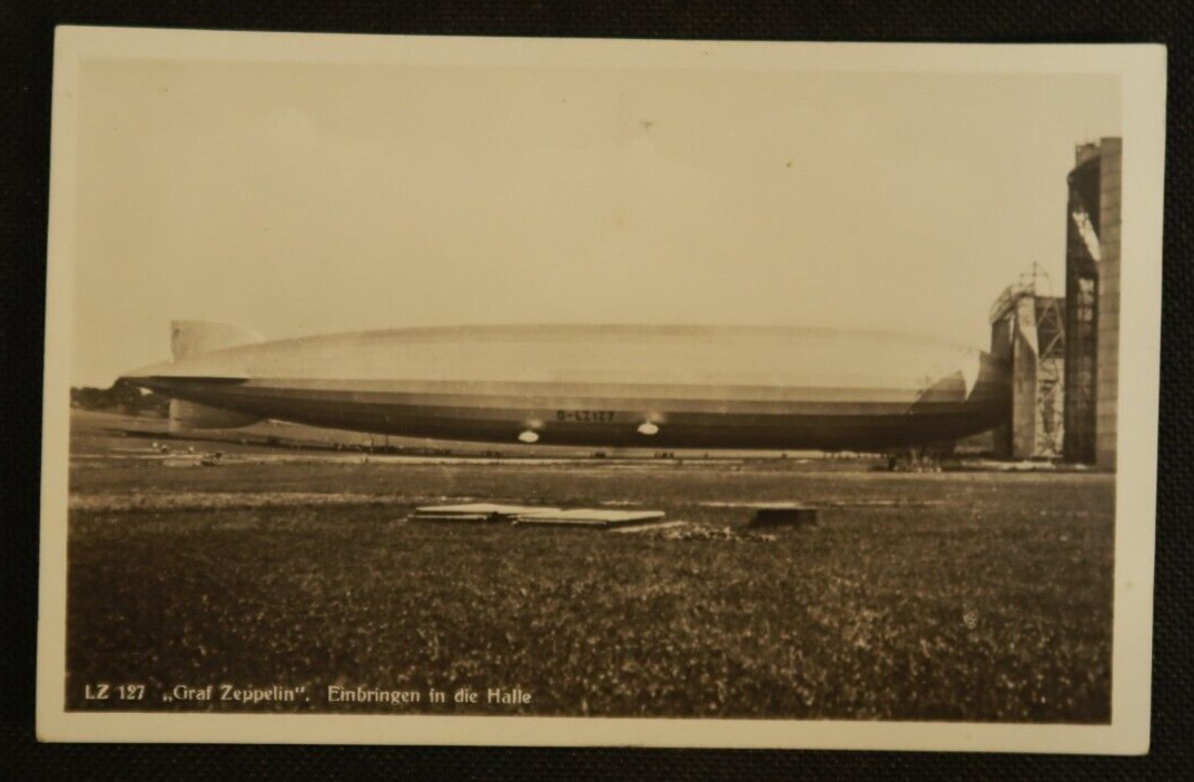 LZ 127 Graf Zeppelin German Postcard Blimp Airship RPPC Bringing Into The Hall