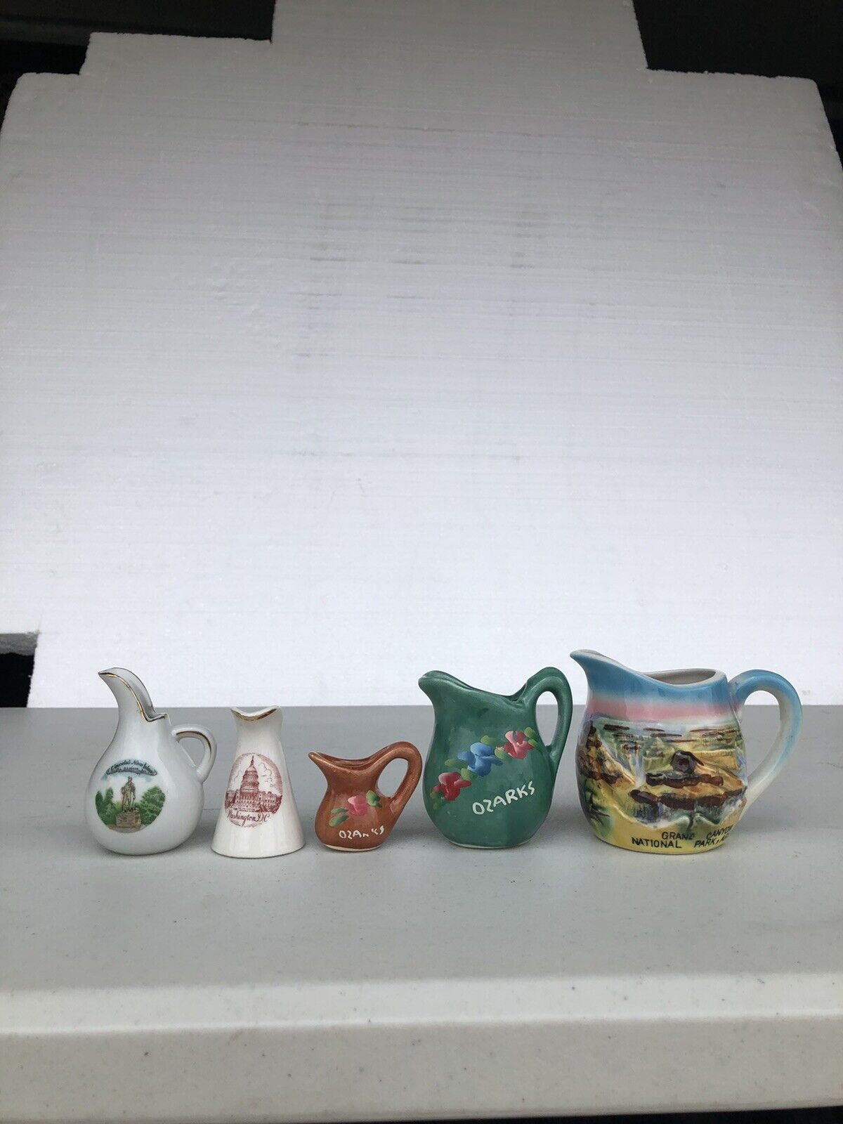 5 assorted souvenir mini pitchers
