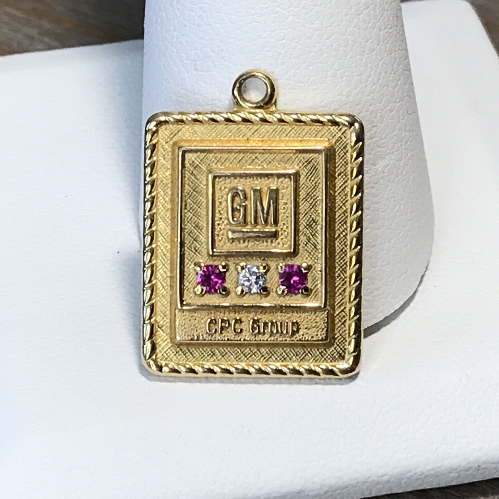 GM 1/10 10K GOLD SERVICE Pendant WITH TWO RUBY STONES ONE DIAMOND