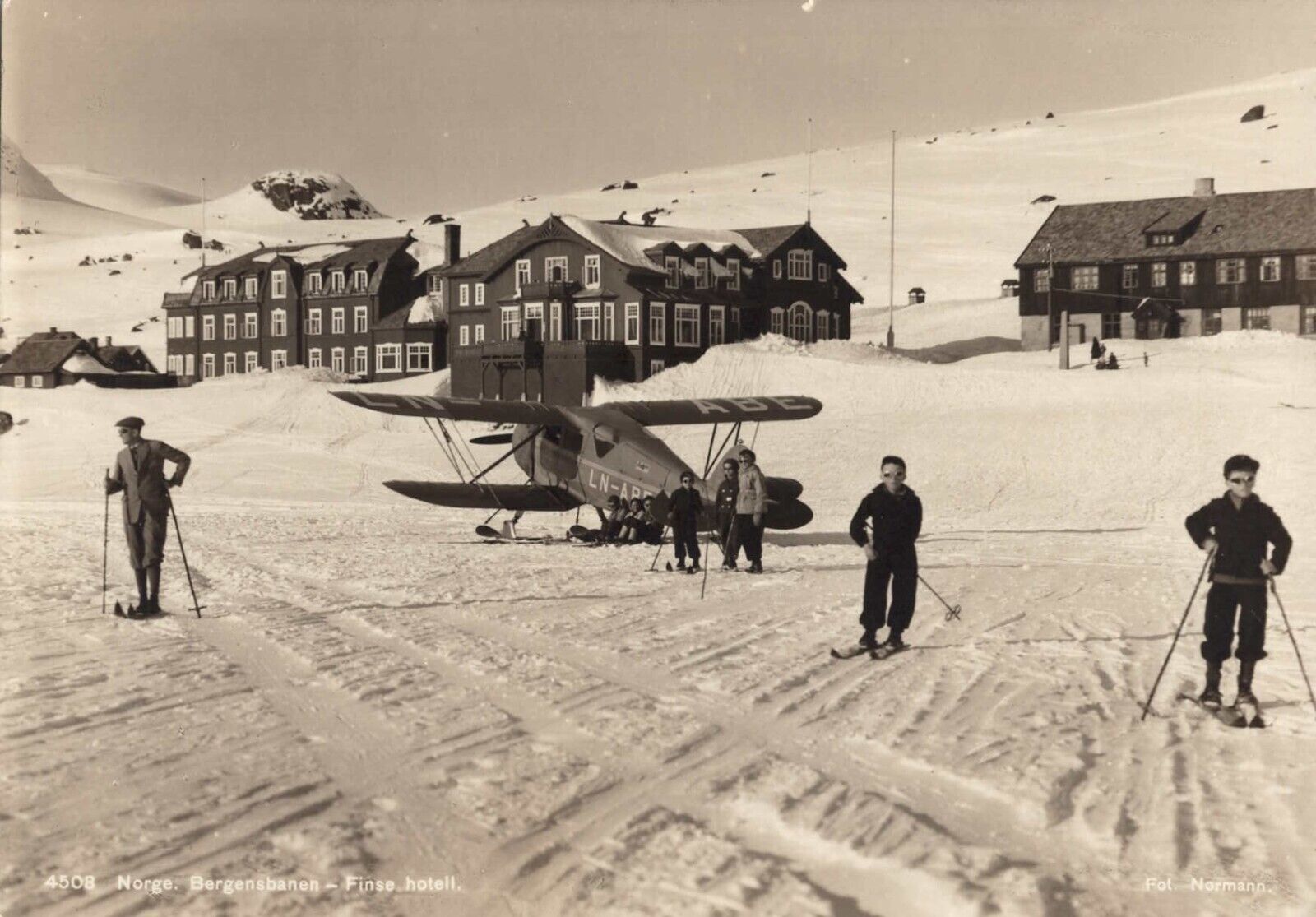 A Skiers Plane Lands on Snow in Norway Bergensbanen-Finse Hotel Vintage Postcard