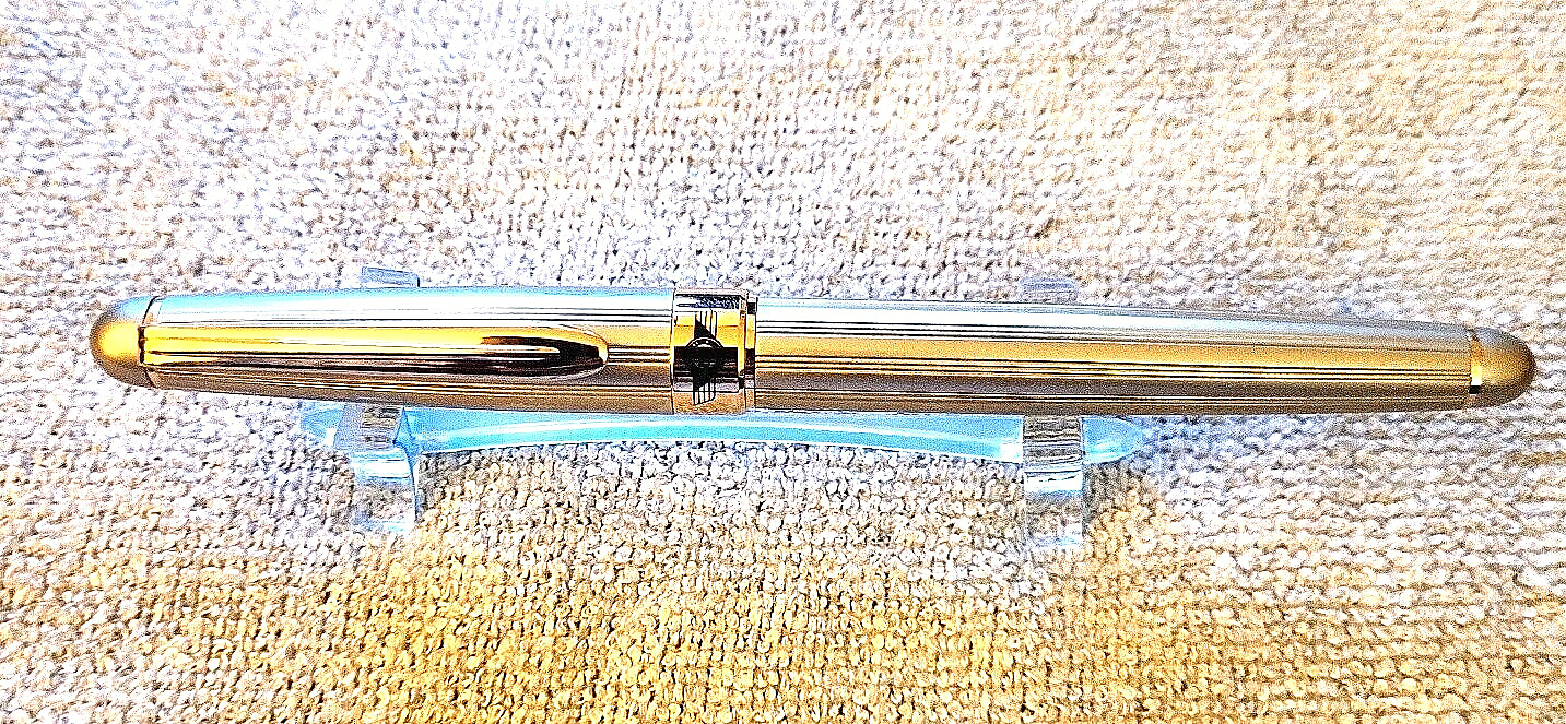 VINTAGE RETRO 51 SERIES 200 ROLLERBALL PEN IN BRUSHED METAL WITH GOLD TRIM.