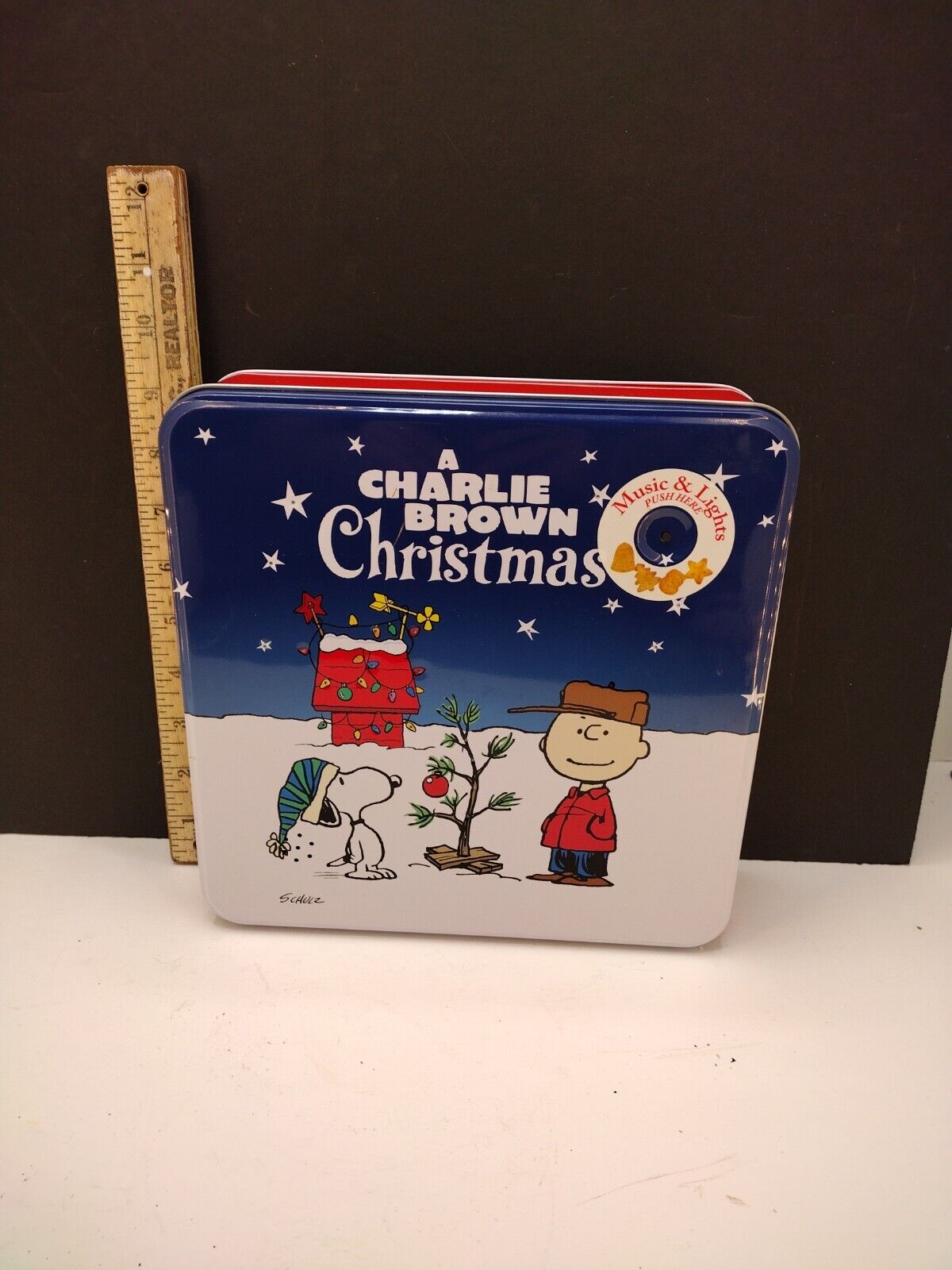 A Charlie Brown Christmas Music And Light Up Tin, works. Super Cool
