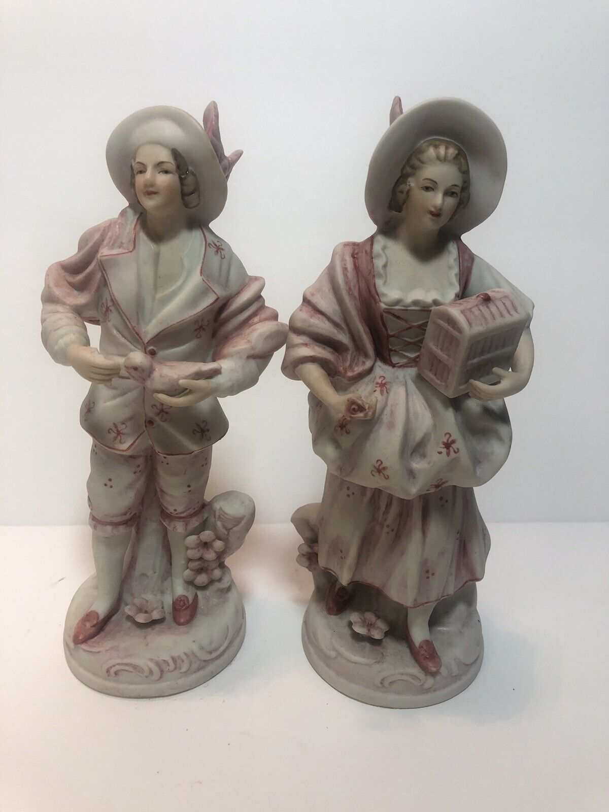Porcelain Victorian Figures: Male w/bird & Female w/Rose 6058