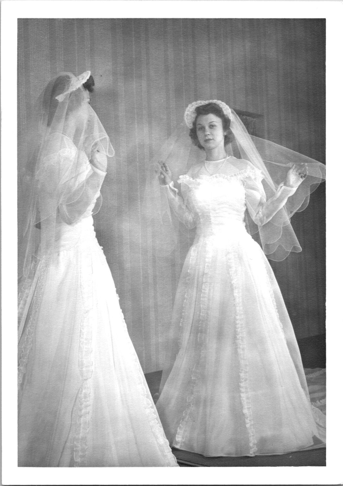 Pretty Women standing infront of mirror wearing wedding dress Found Photo V0659