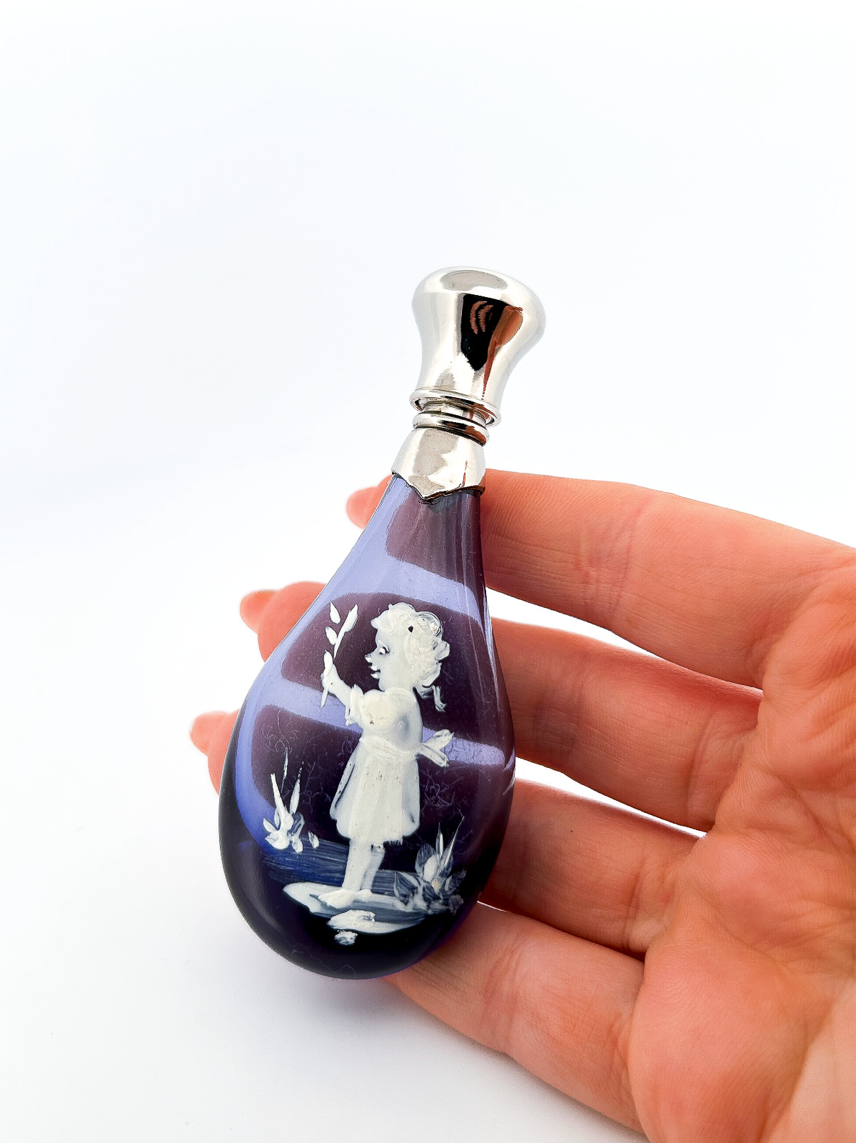 A Faceted Vintage Victorian Style Blue Novelty Perfume Bottle with Painted Girl