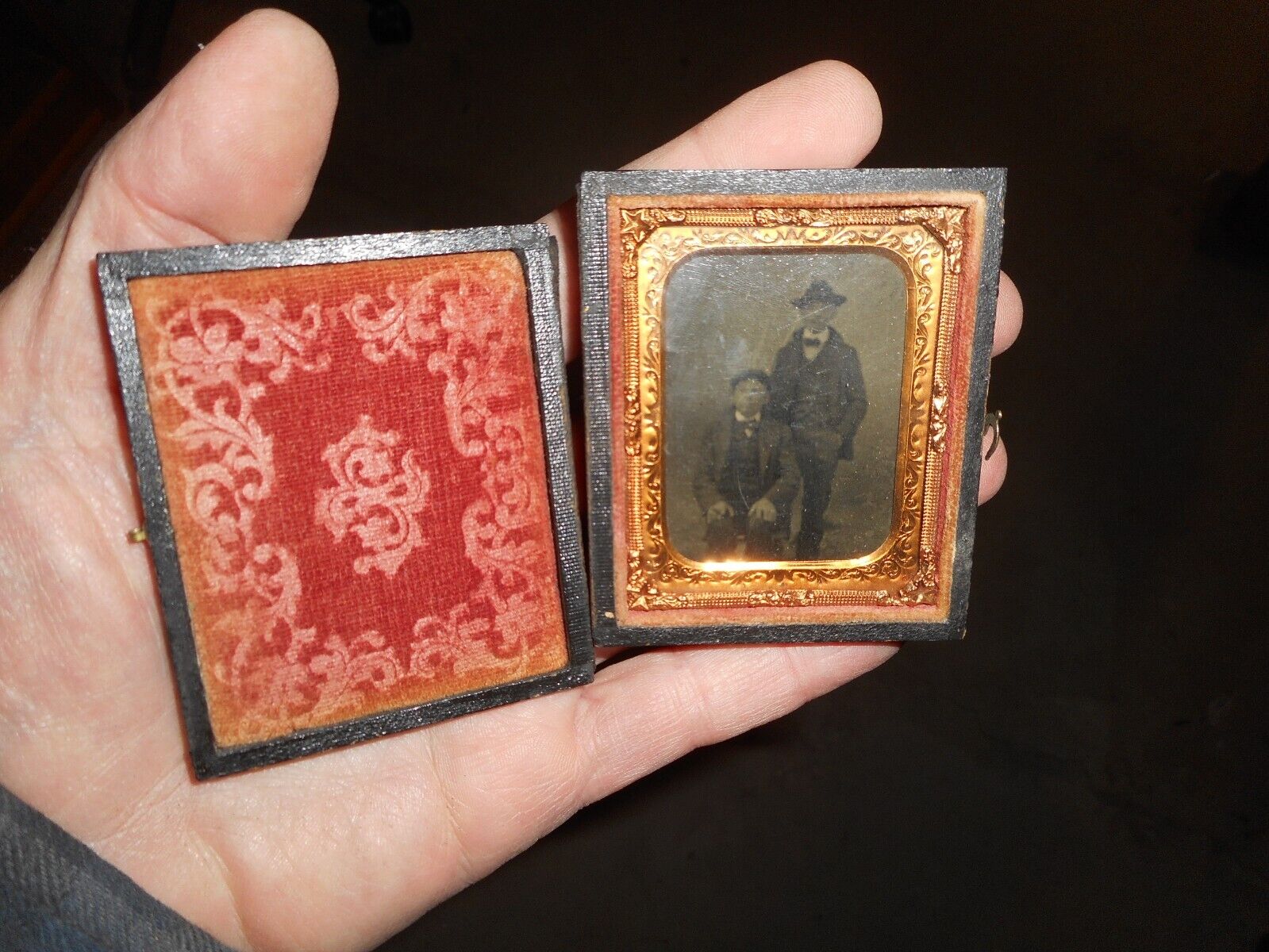 antique tintype of 2 men in hats, in full split leather case