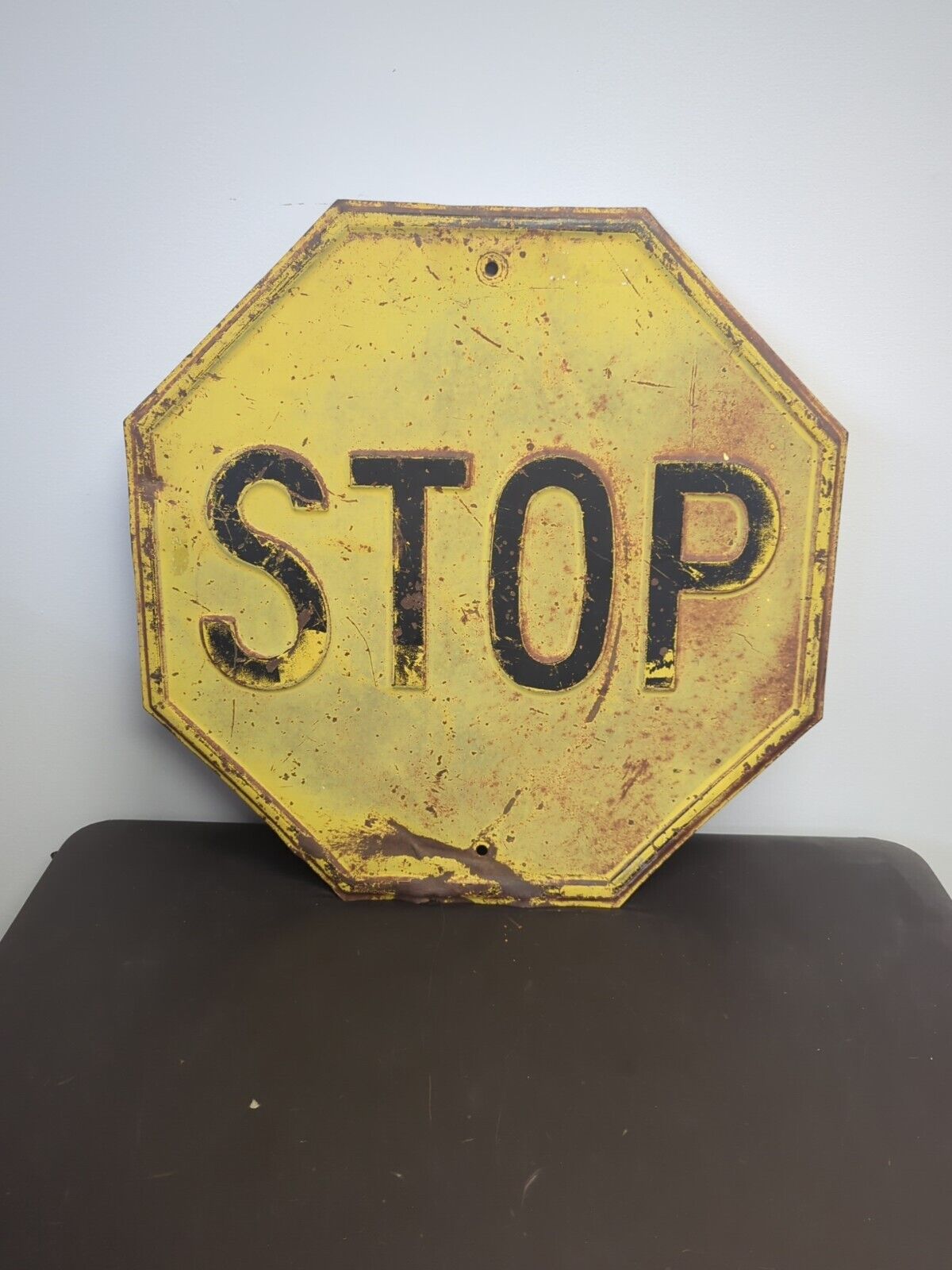  24” Stop Sign Black on Yellow Heavy Embossed Steel VTG