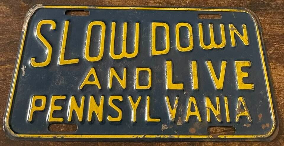 Vintage Slow Down and Live Pennsylvania Booster License Plate Rare Item PA STEEL