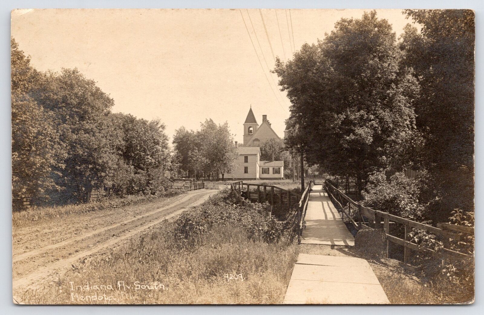 Mendota IL~Indiana Ave, Footbridge Crosses Brook~1st Baptist RPPC CR Childs 1910