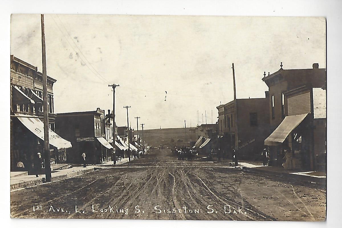 1909 Sisseton, South Dakota, 1st Ave. L. Looking S. RPPC
