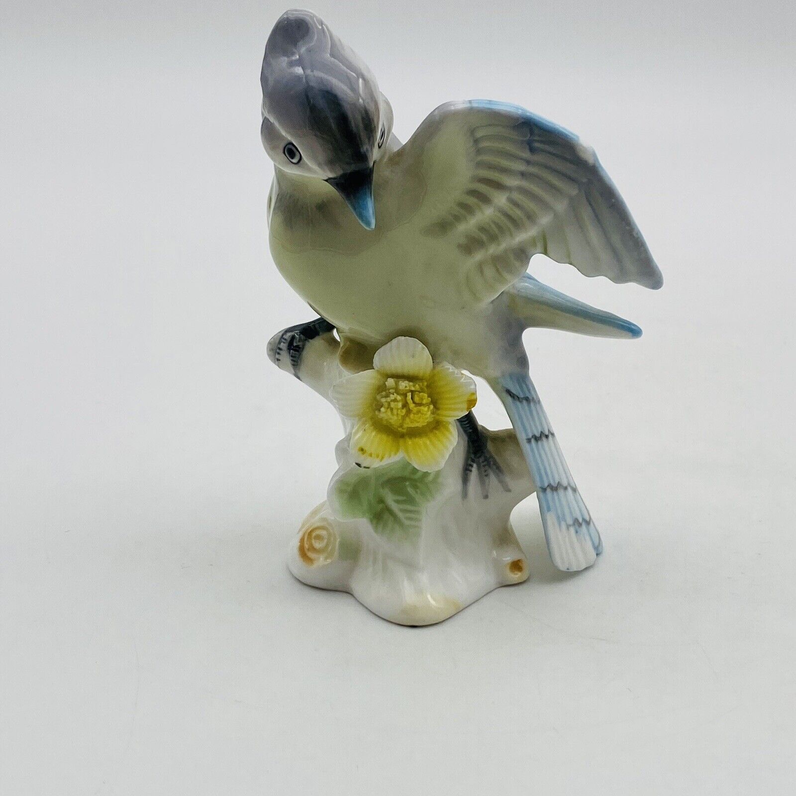 Vintage Gray Bird With Blue Accents Sitting On Stump