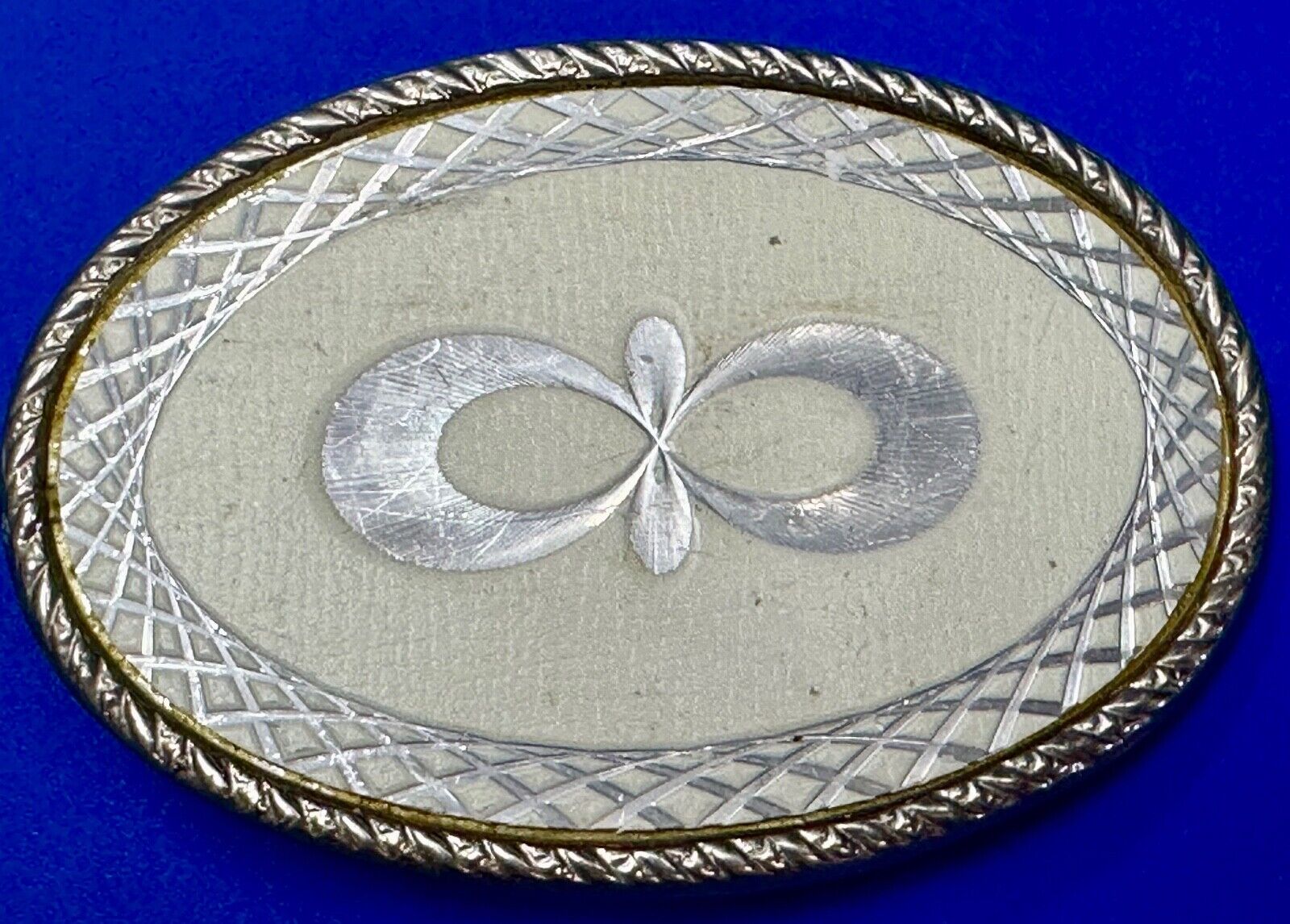 Vintage White & silver color etched oval western belt buckle marked W