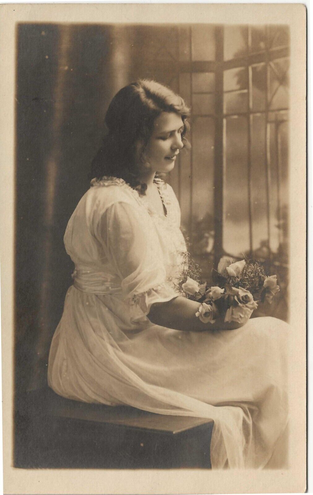 RPPC Young Woman in Studio Holding Flowers c1910 Real Photo Postcard