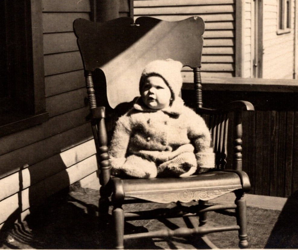 RPPC Adorable Cozy Dressed Baby Sits In Rocking Chair Outside ANTIQUE Postcard