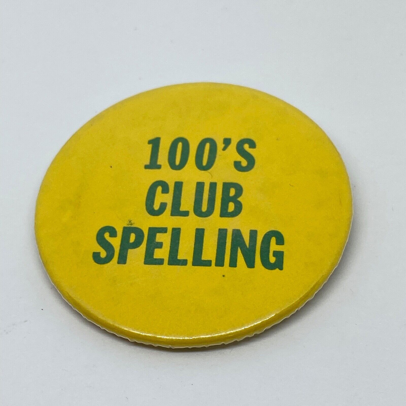 Vintage 100's Club Spelling Button Pin