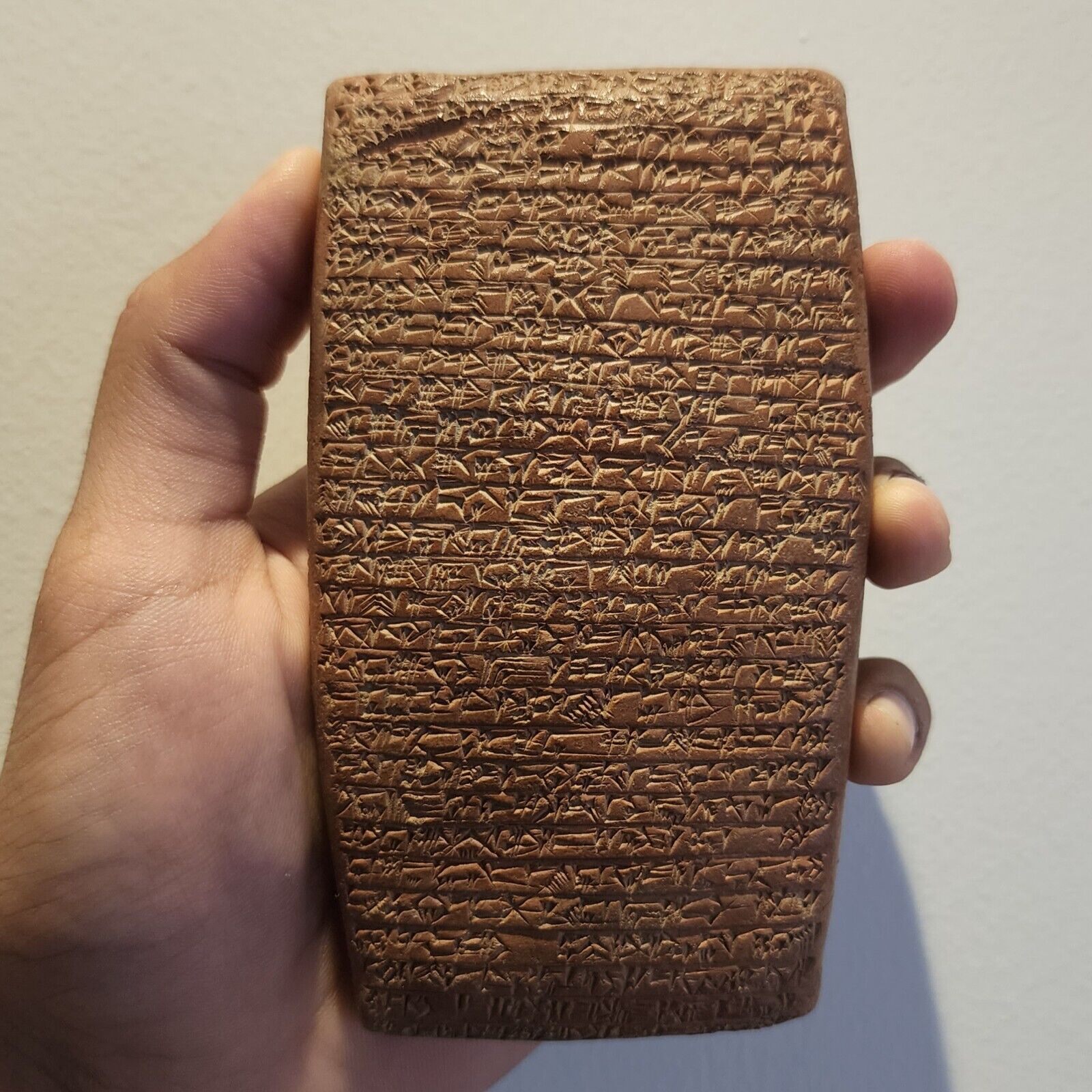 CIRCA NEAR EASTERN CUNEIFORM TERRACOTTA CLAY TABLET WITH EARLY FORM OF WRITINGS.