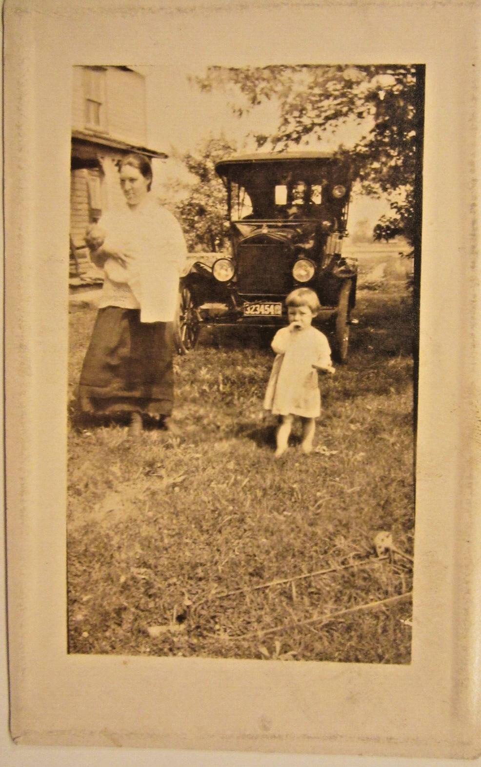 1917 ? FORD MODEL T TOURING on grass & Mom & kids. RPPC, 5 3/8\