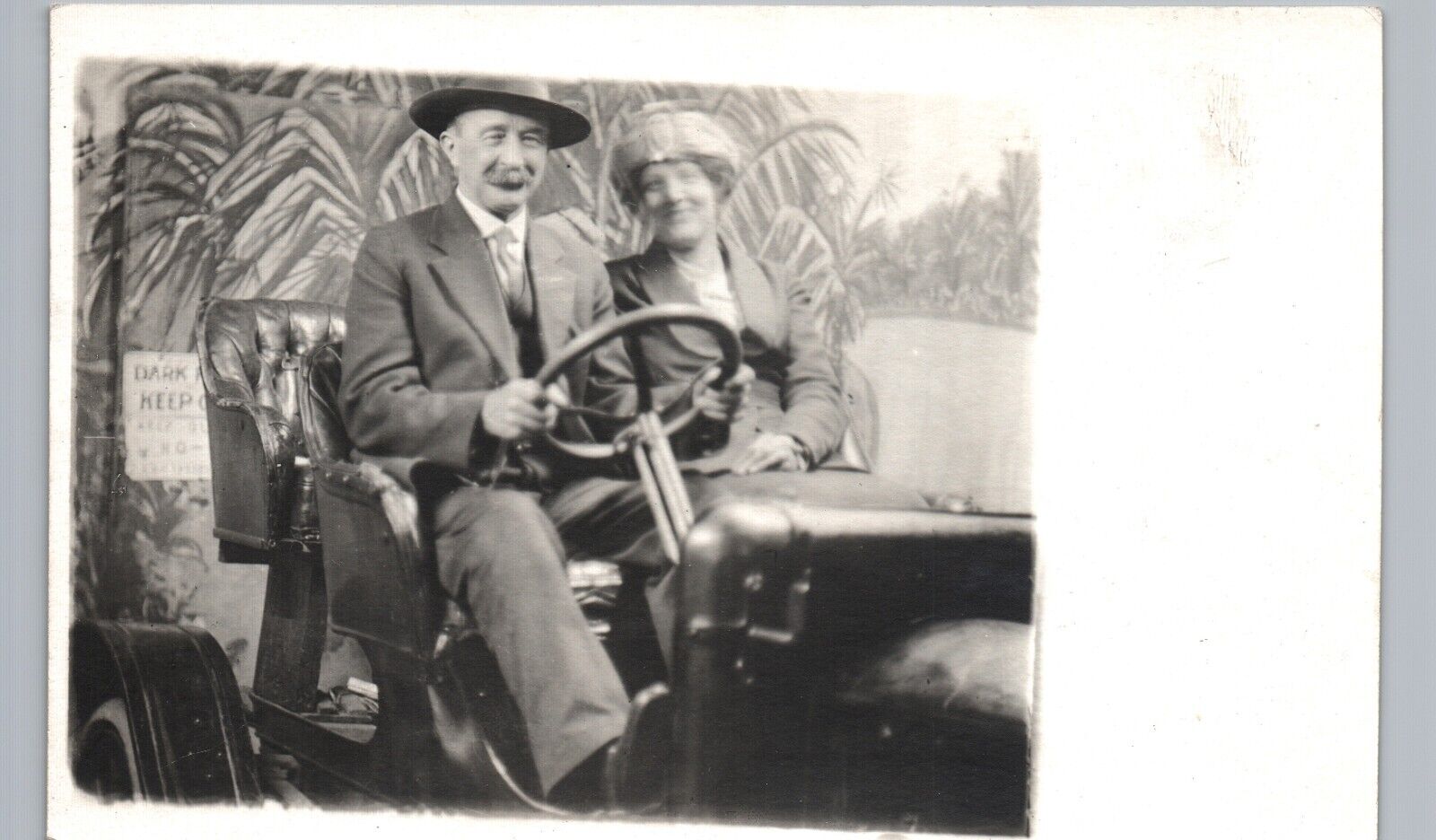 DRIVING SILLY PROP CAR real photo postcard rppc early arcade auto car man woman