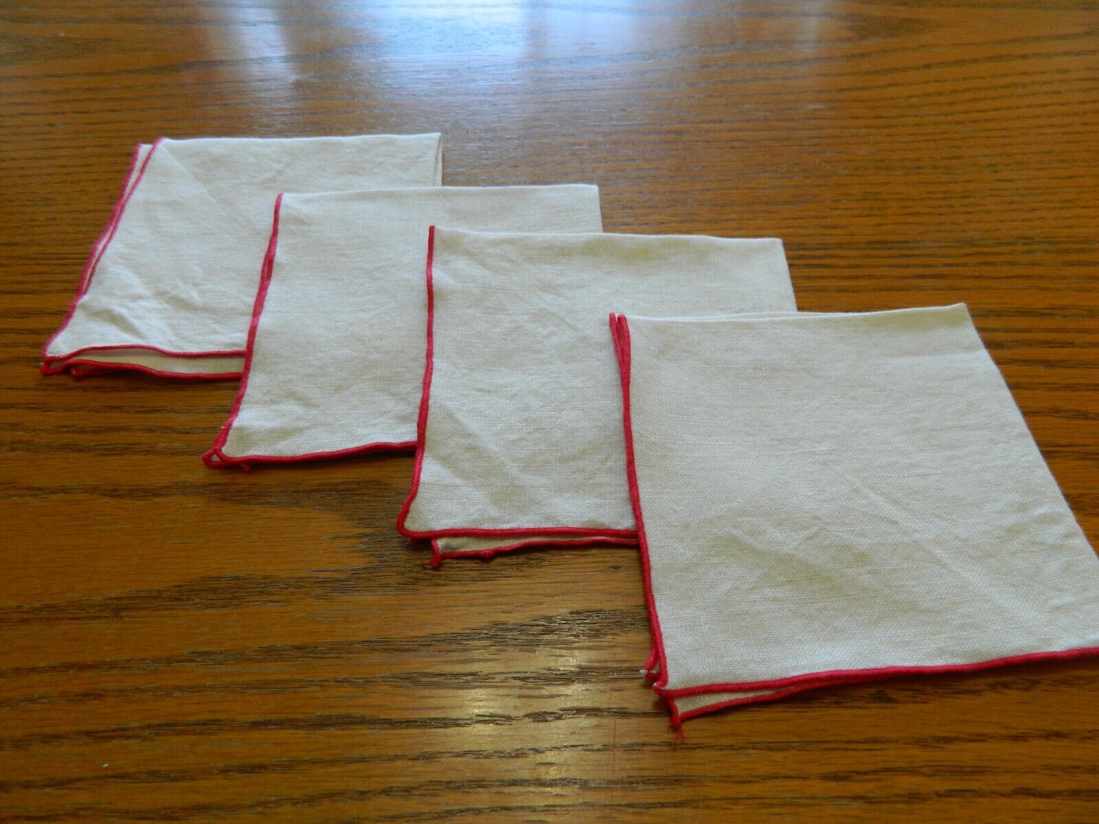 L-24 4 VINTAGE WHITE LINEN NAPKINS WITH RED EDGING