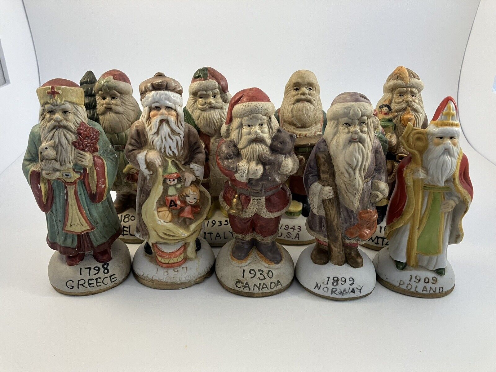 Vintage Santa\'s from Around the World Set of 9 Ceramic Christmas Collectibles
