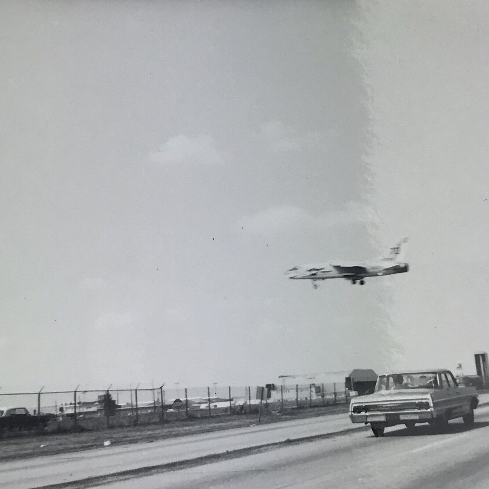 Vintage 1964 Black and White Photo Airplane Flying Over Highway Landing Airport
