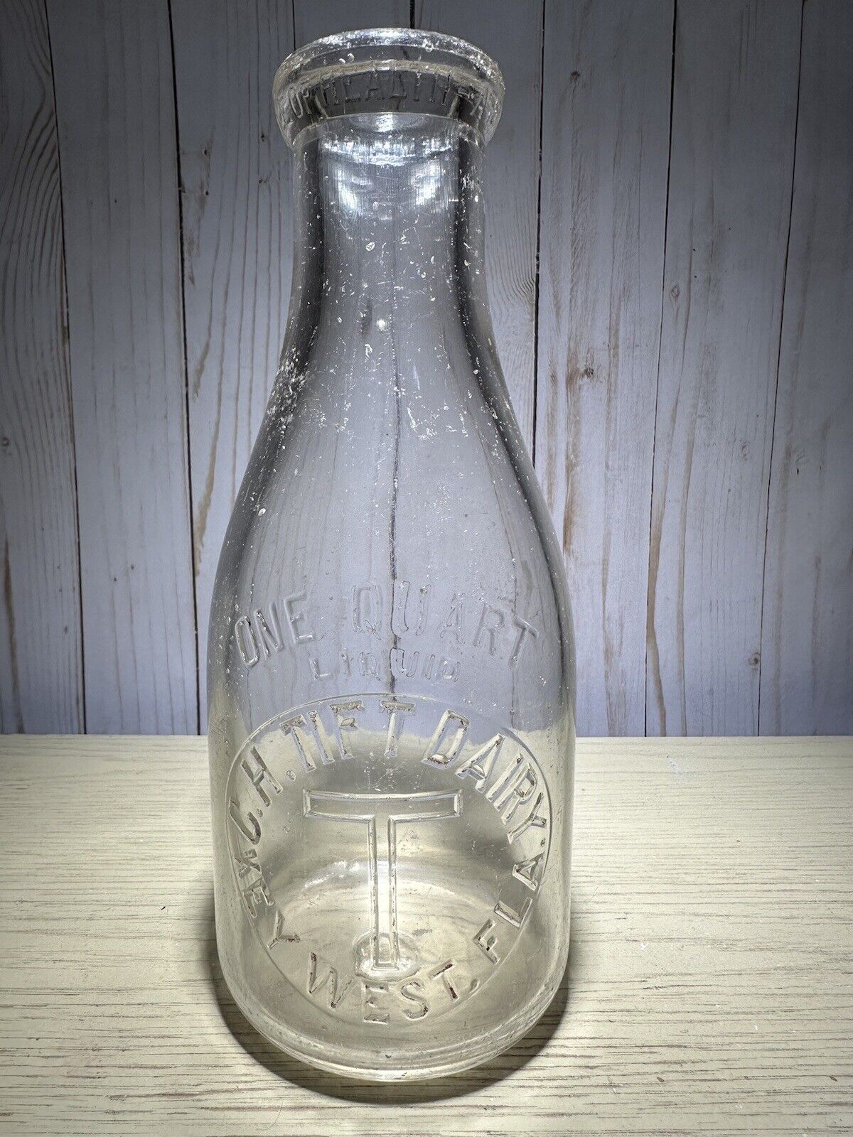 Key West Milk Bottle Tift Dairy Quart Embossed Has A Chip On Bottom Heel Rare.