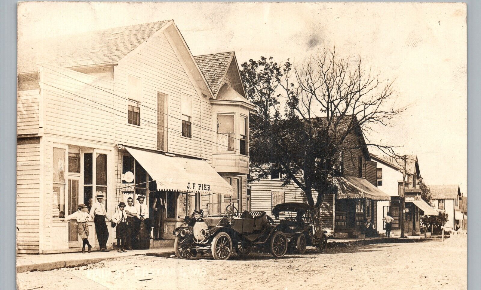 EASTMAN WI MAIN STREET STORE real photo postcard rppc WISCONSIN 1910 antique car