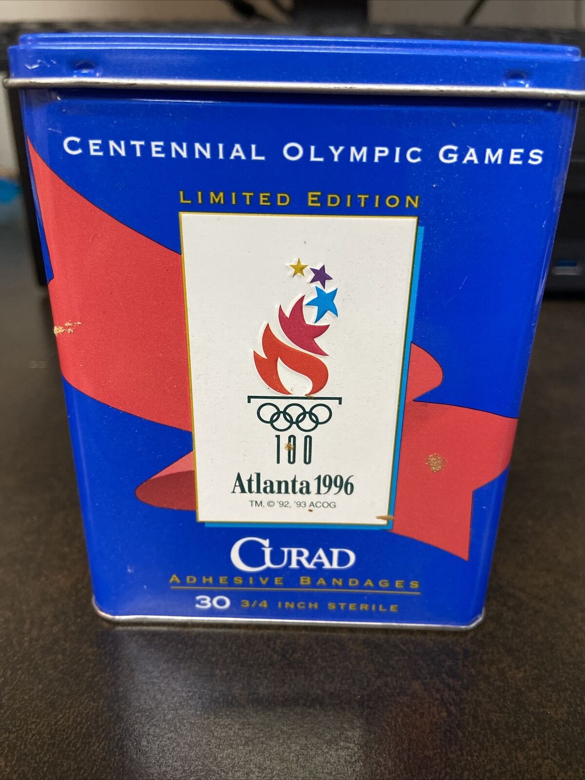vintage Curad Centennial Olympics bandages and tin