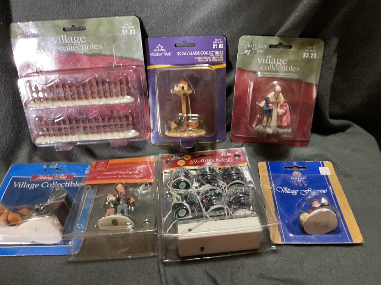 lot of mixed christmas village parts and figures