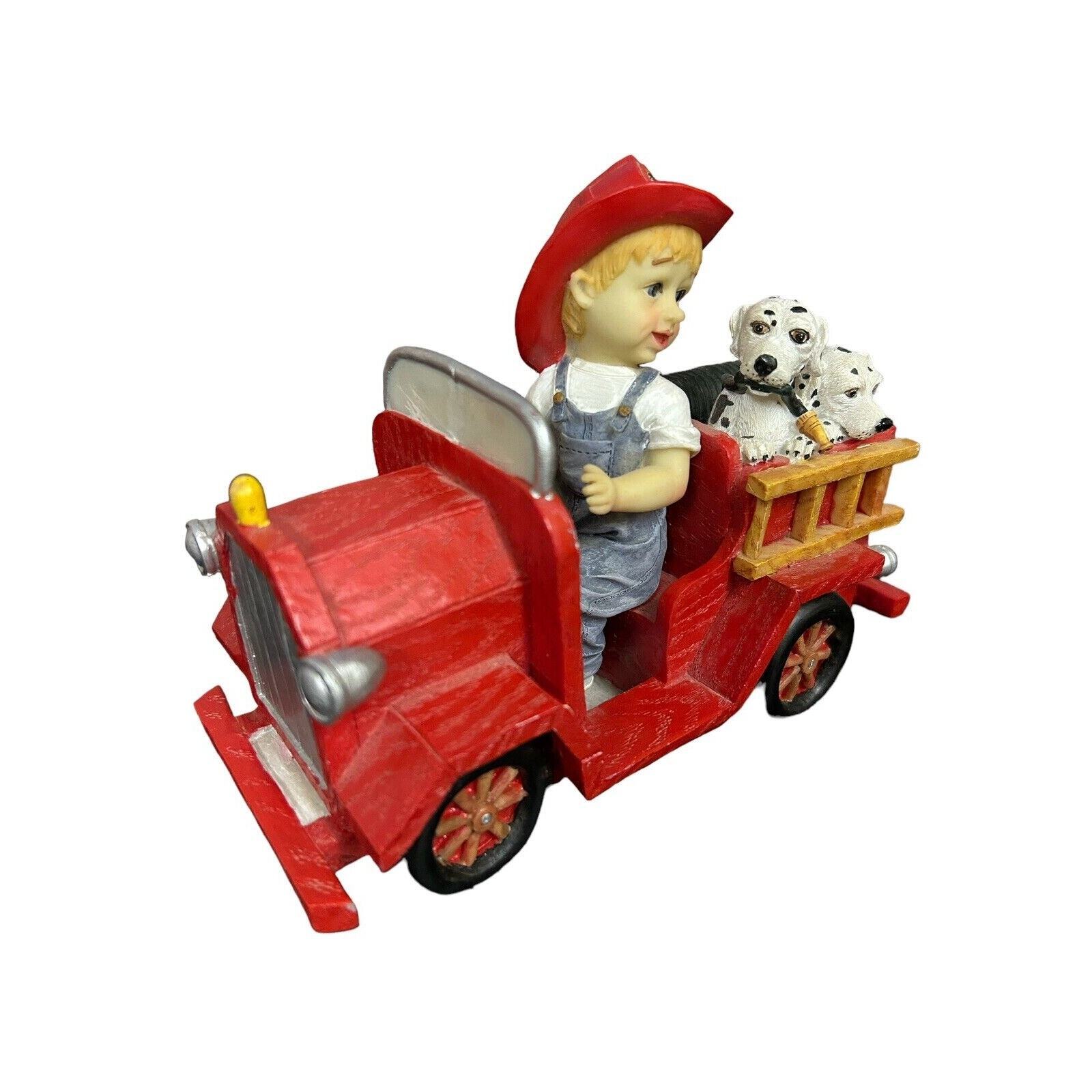 Child Fireman & His Fire Truck with 2 Firemen’s Dalmatian Dogs Statue Figurine