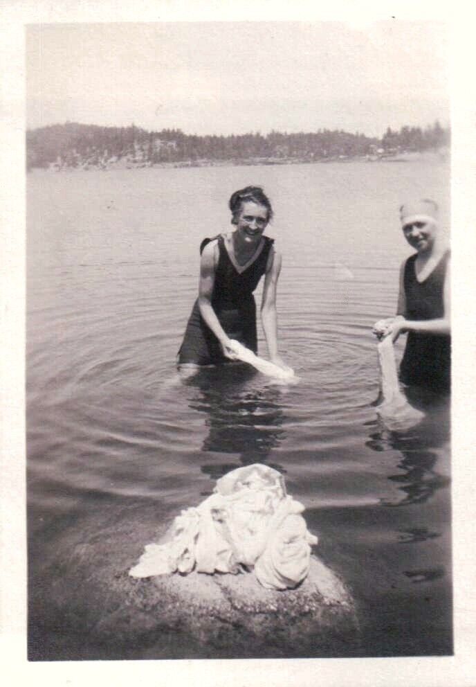 Vintage Old 1930s Photo of Muscular Skinny Woman Washing Pile of Clothes in Lake