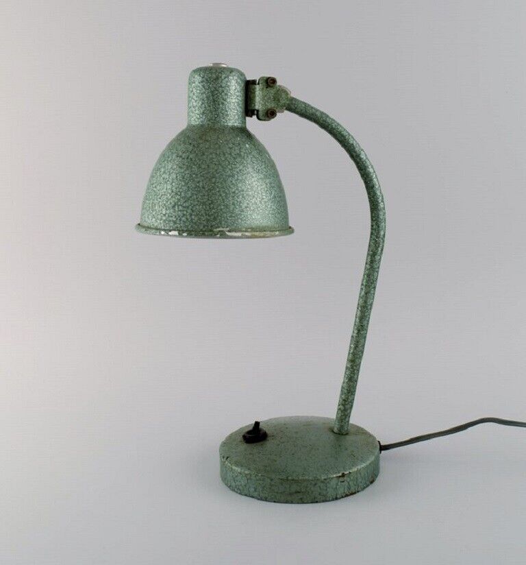 Adjustable desk lamp in original mint green lacquer. Industrial design.