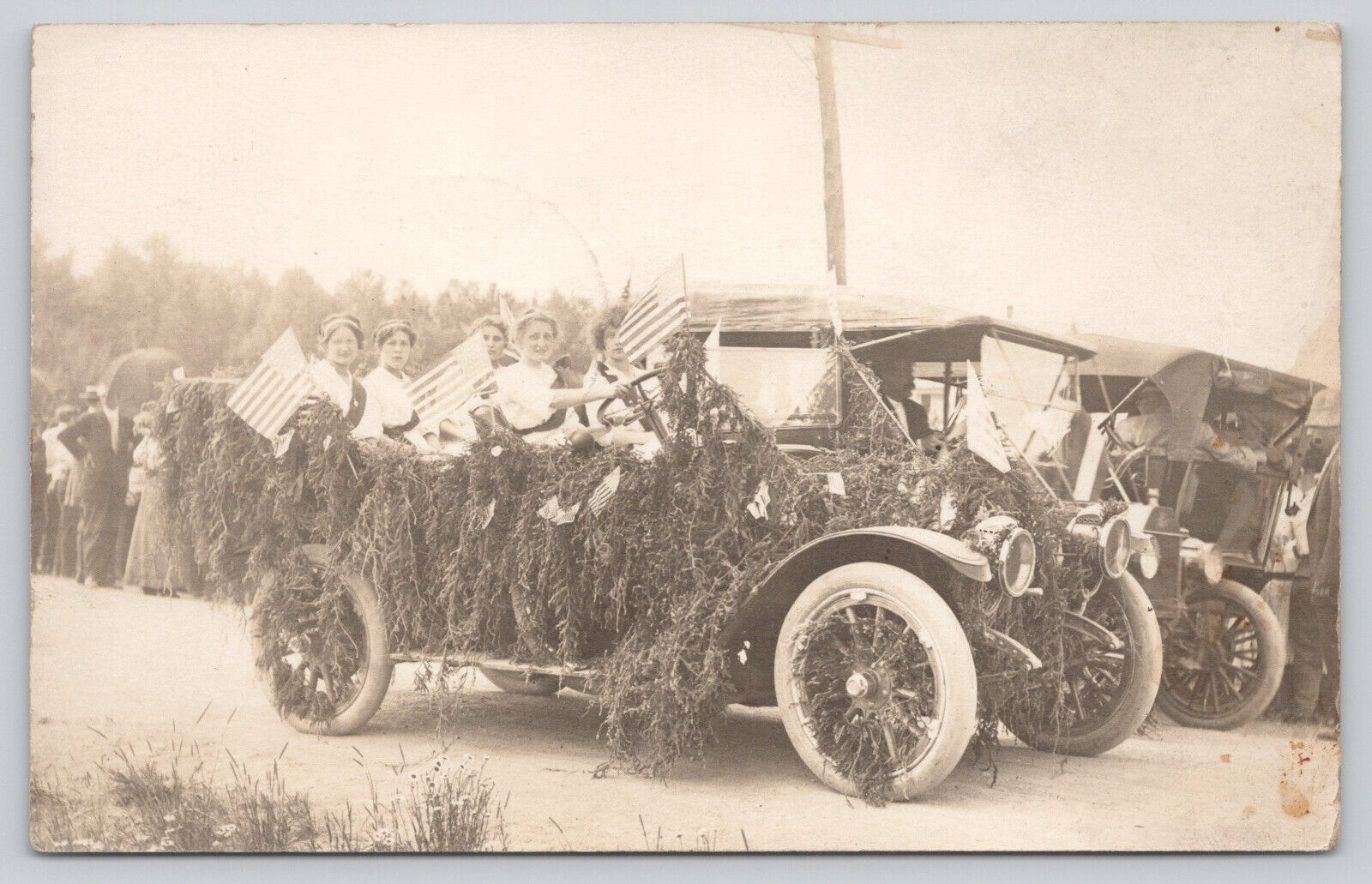 RPPC 1913 Automobile Flowered for Parade Waving American Flags (808)