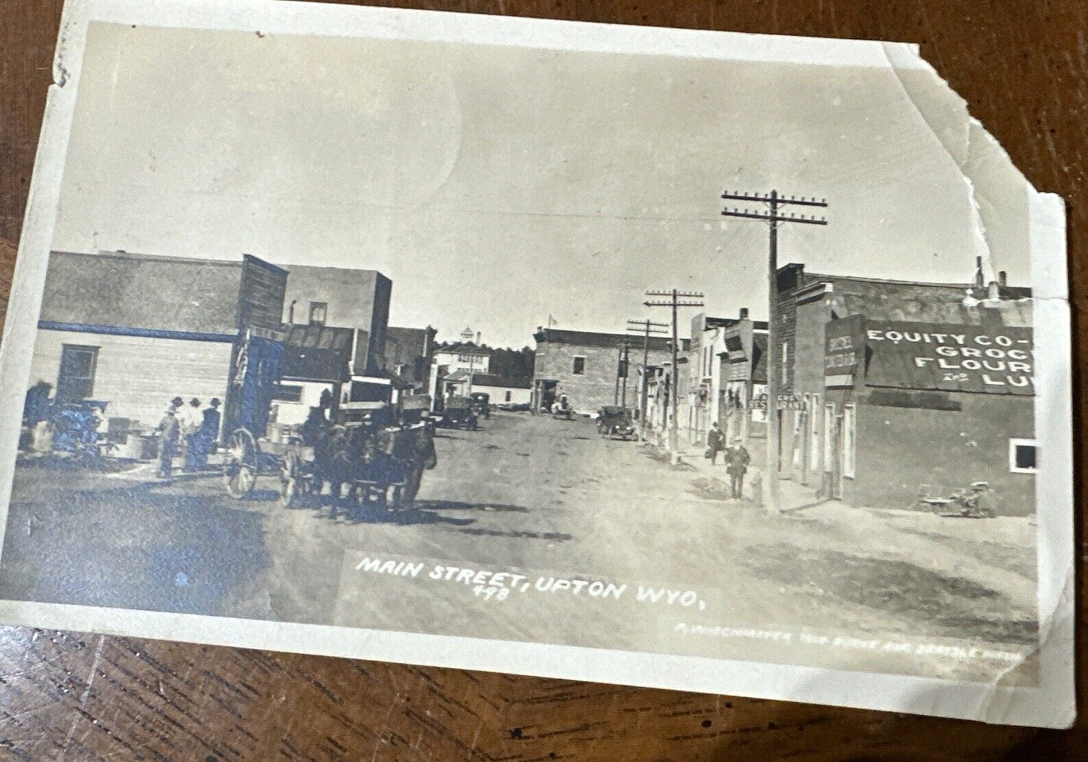 Upton WY - RPPC Main Street - Wyoming Real Photo Postcard Damage Horses Car Wago