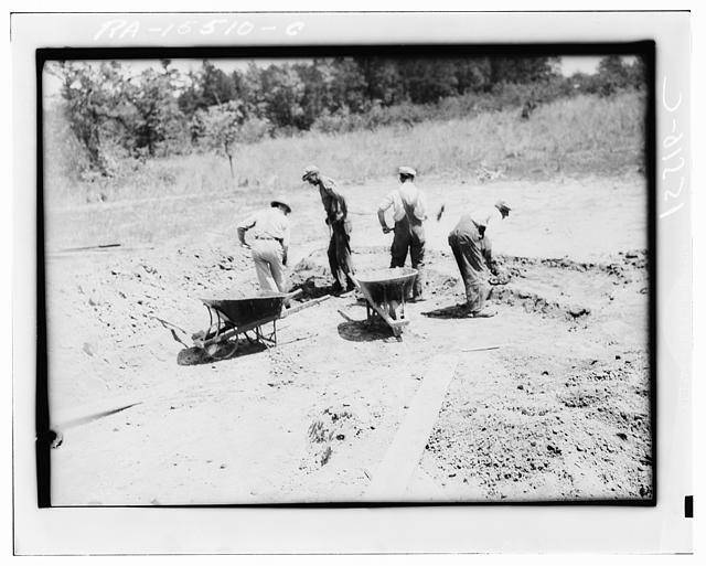 Digging dirt used in rammed earth construction near Birmingham, Alabama