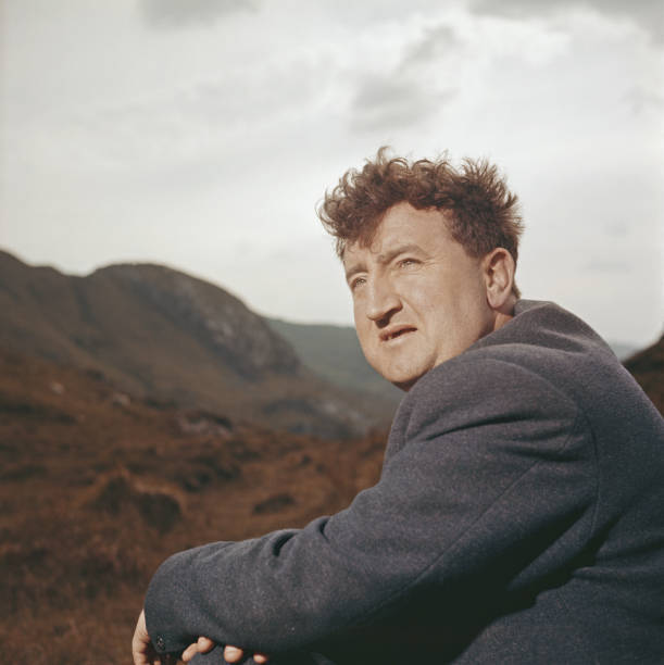 Irish poet and writer Brendan Behan pictured on a hillside in - 1960s Old Photo