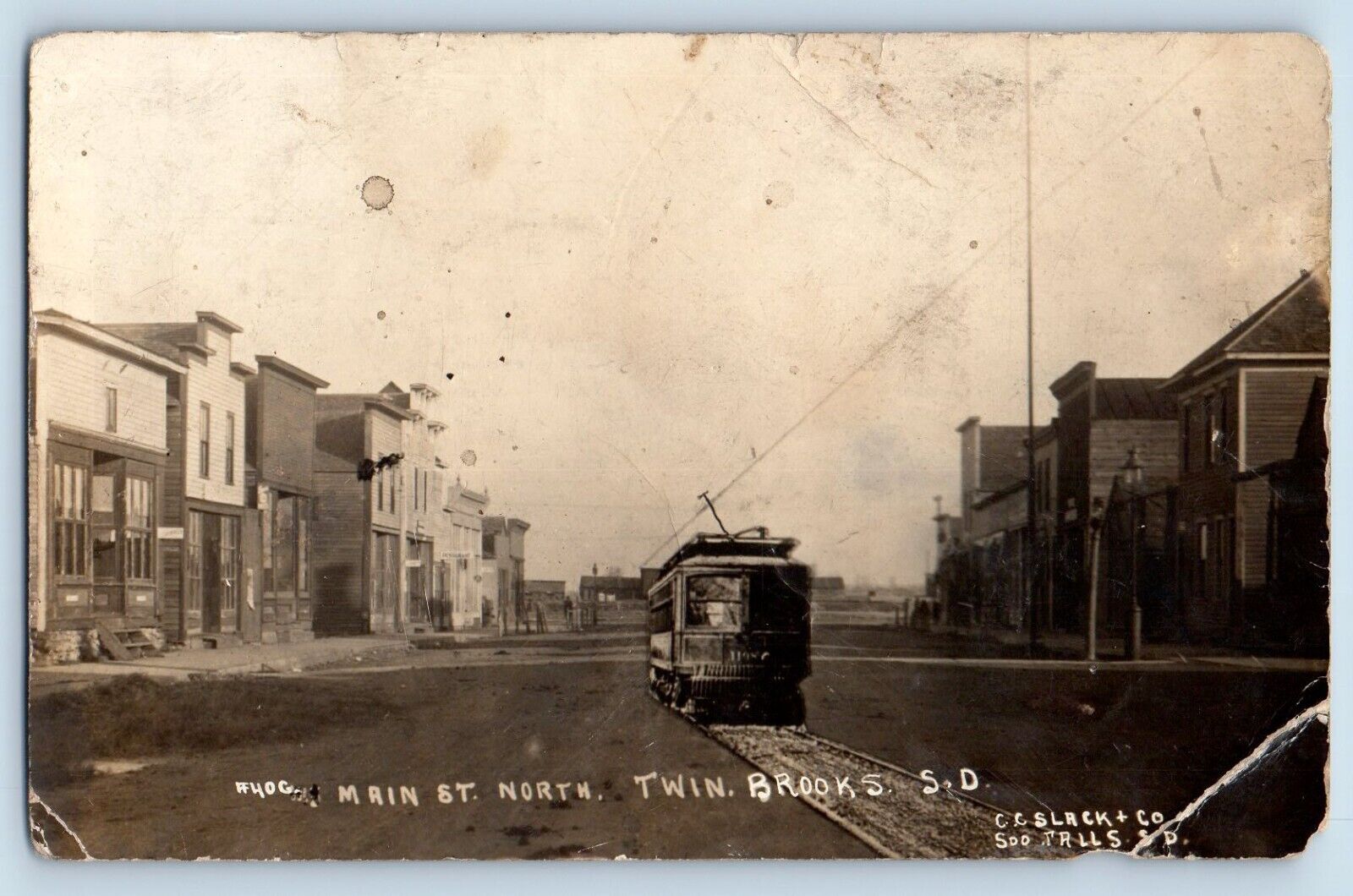 Brooks SD Postcard RPPC Photo Main St. North Twin Photoshopped Street Trolley