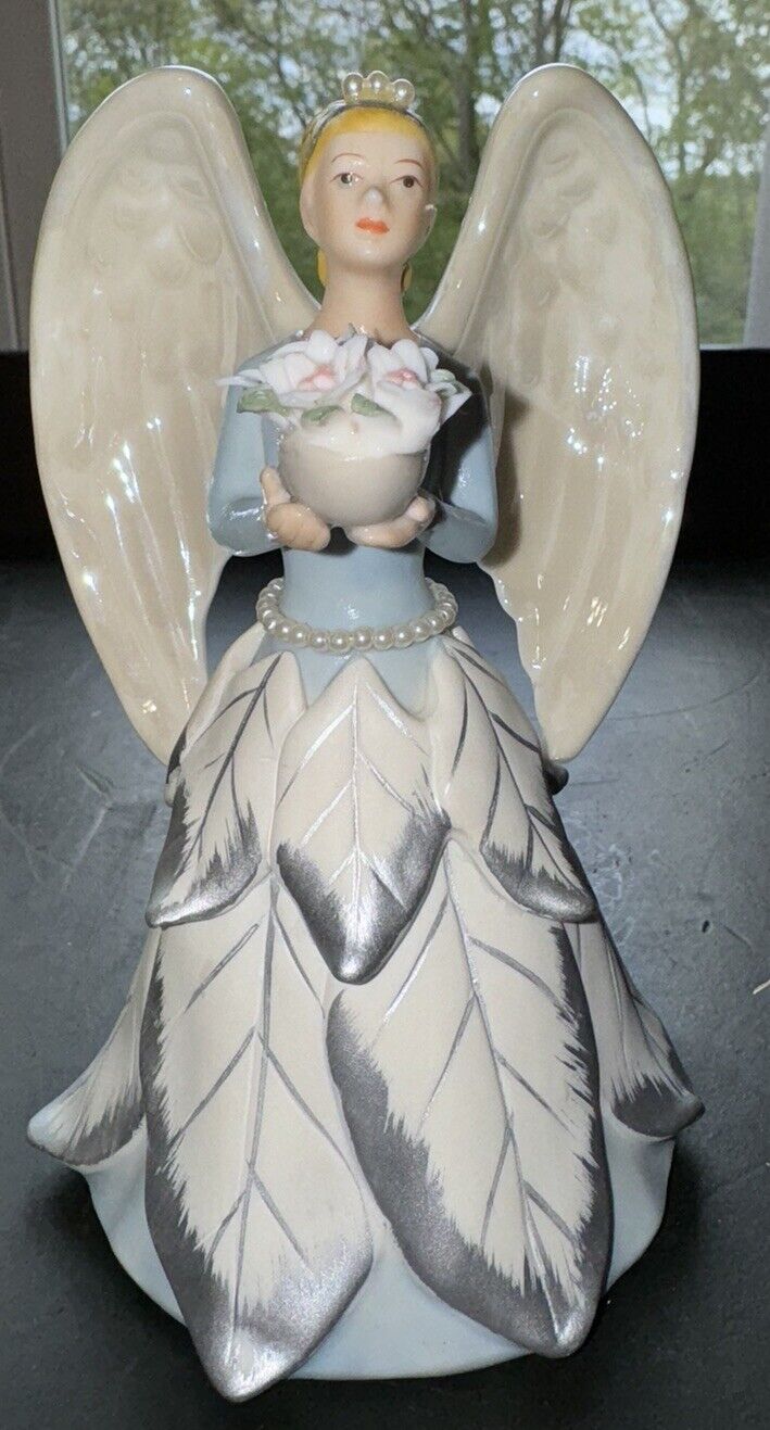 Avon 2006 Winter Angel Holding Flowers Porcelain Figurine 6” Tall Beautiful
