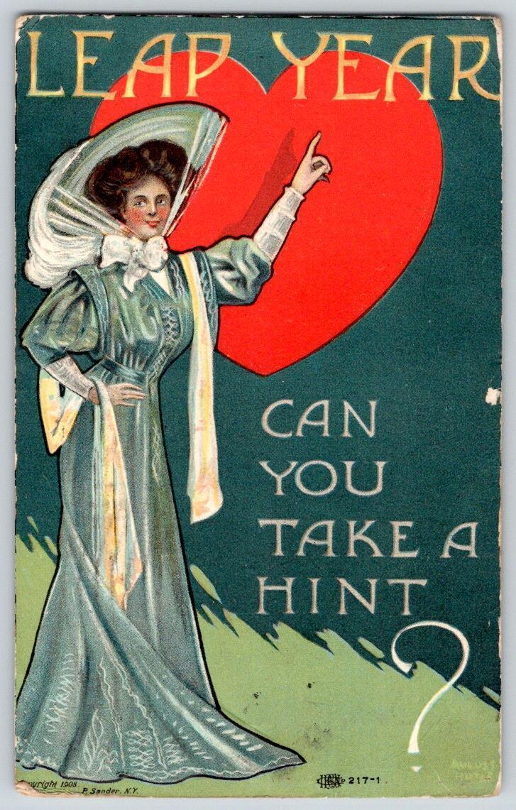 1908 LEAP YEAR CAN YOU TAKE A HINT? WOMAN FANCY DRESS HAT BIG RED HEART POSTCARD