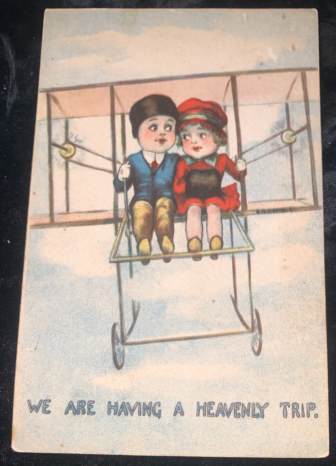 C1910  Antique Art COMIC POSTCARD BOY AND GIRL IN BI-PLANE HAVING HEAVENLY TRIP