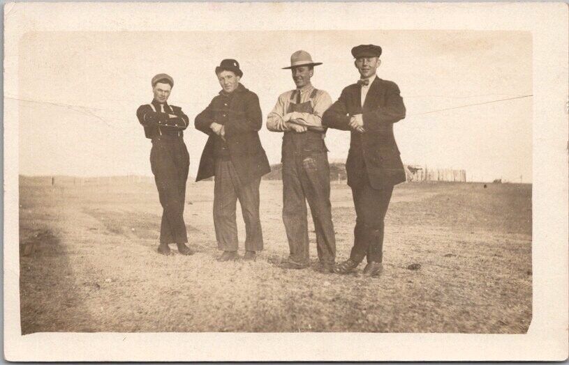 1910s ND RPPC Photo Postcard 4 Guys in Very Unnatural Poses Prairie Homesteader