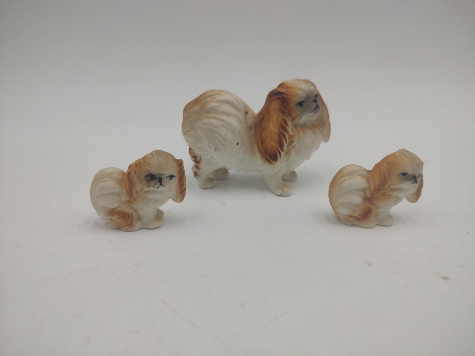 3 Porcelain Pekingese Dog Figurines Mom And Puppies Vintage White And Tan