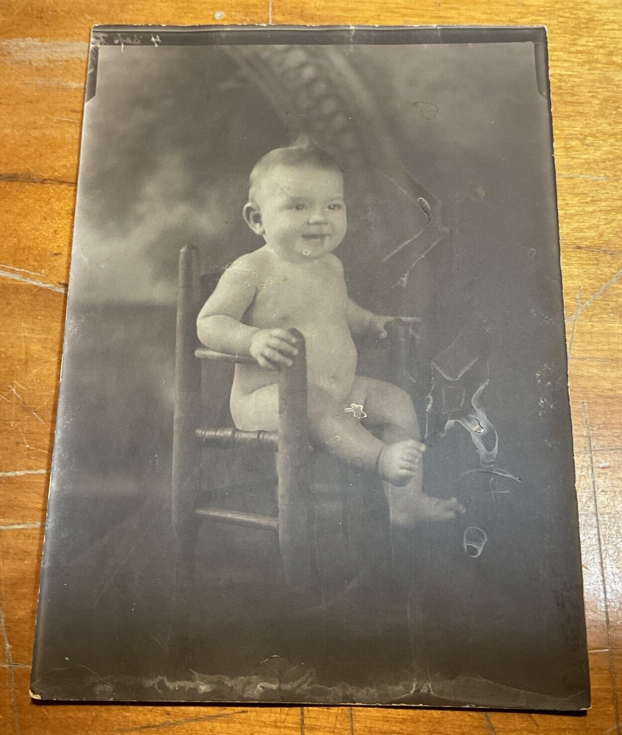 Portrait Of A Baby In A Chair.