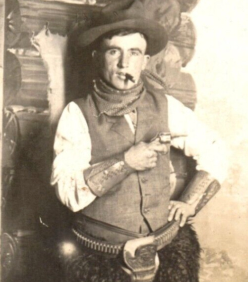C.1910 RPPC SIOUX FALLS, SD STUDIO COWBOY ATTITUDE GUN CIGAR PHOTO Postcard P49